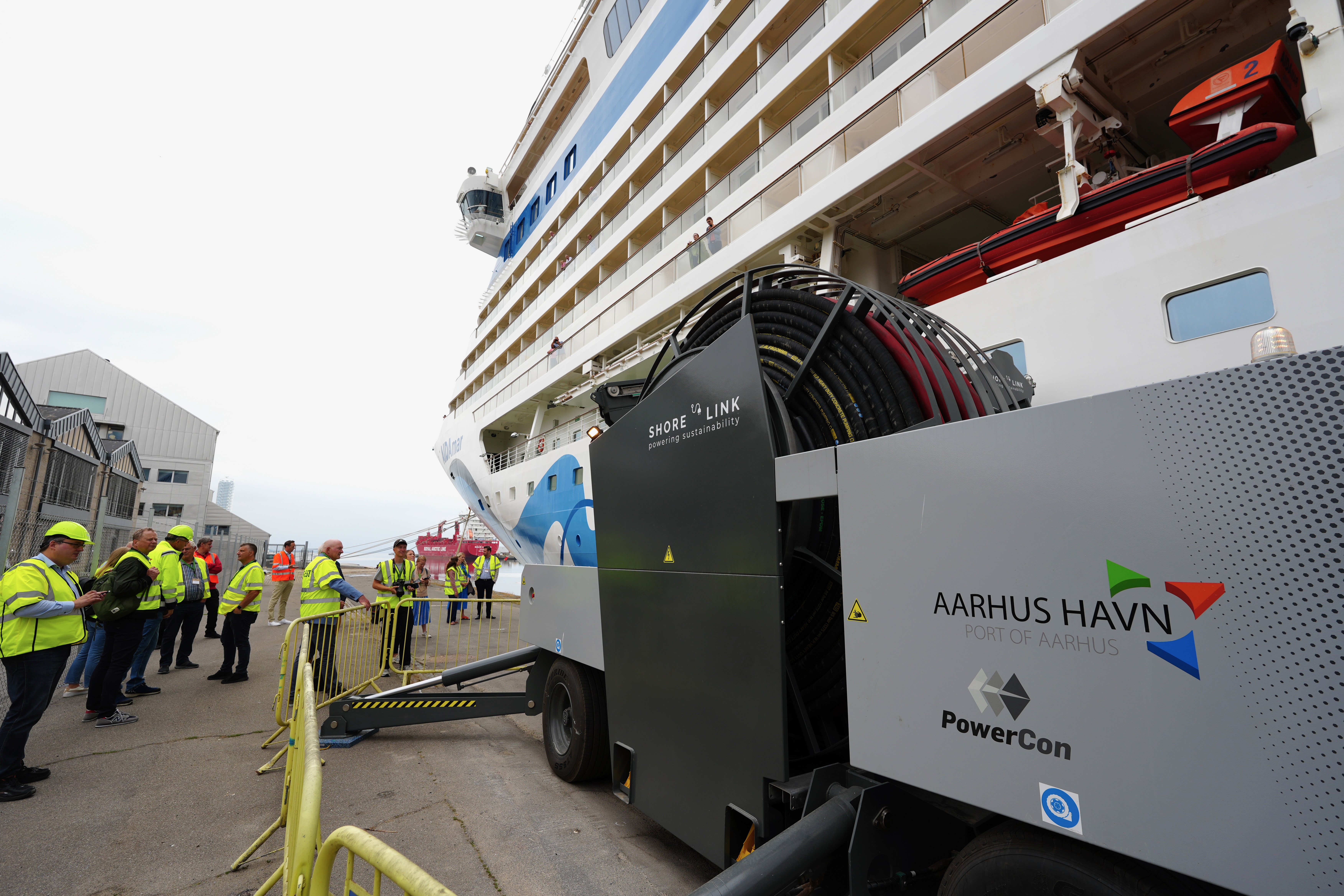 AIDA Cruises: Opening of Denmark's first shore power facility with AIDAmar in Aarhus. After Germany, Norway and the UK, Denmark is now the fourth European country where AIDA ships can now reduce their emissions (Image at LateCruiseNews.com - June 2023)